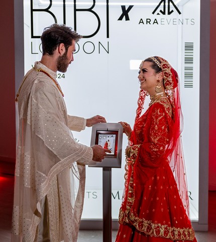 Guests collecting their magazine cover at the instant sharing station
